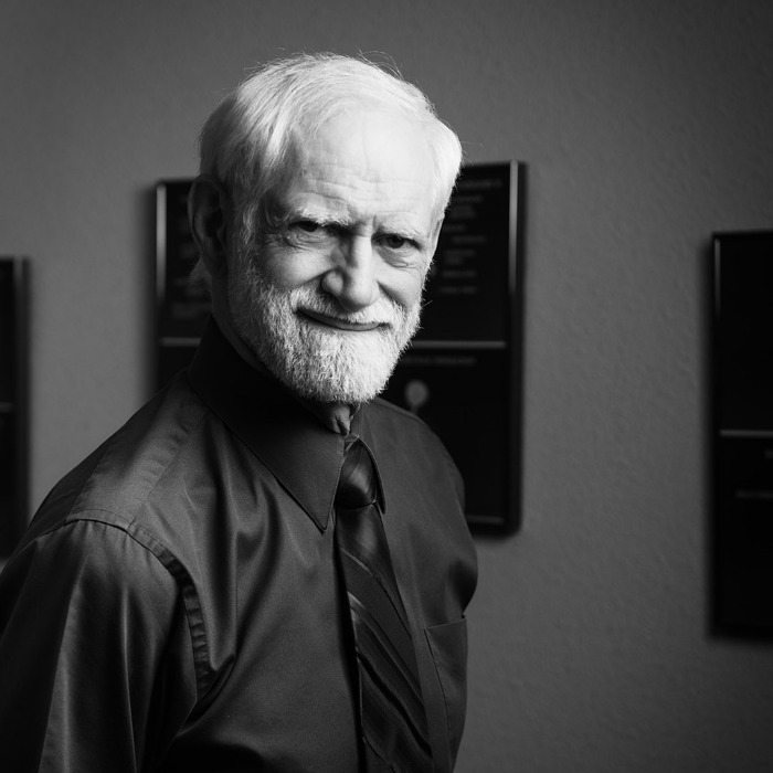 Headshot of Dr. Risch in his office, black and white photo
