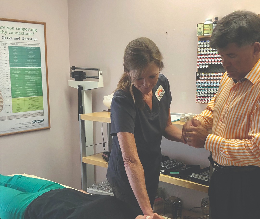 Dr. Lance with a patient Dr. Lance with a patient